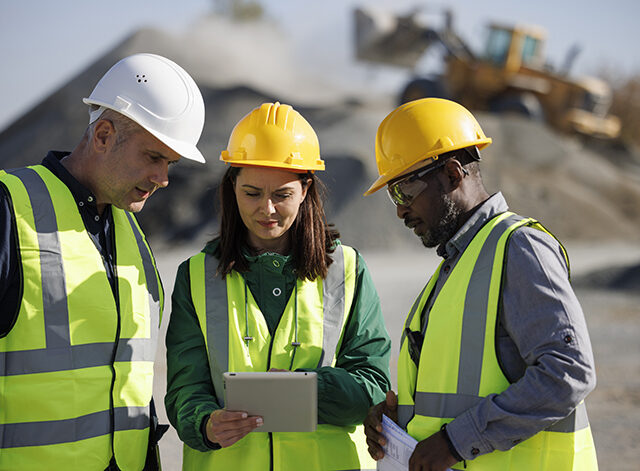 Engineers discussing at building site