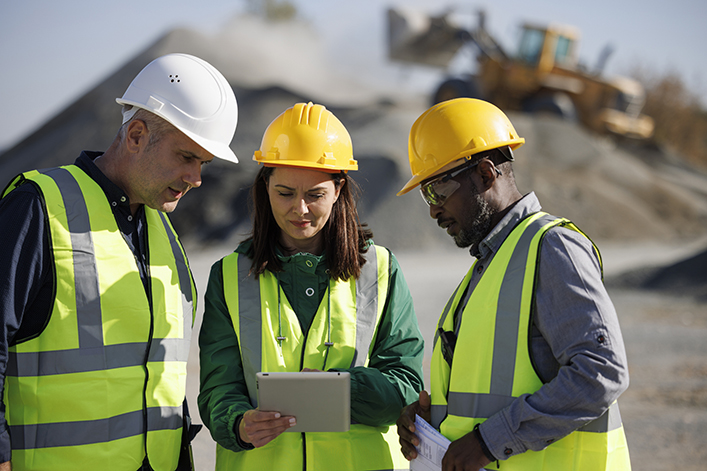 Engineers discussing at building site