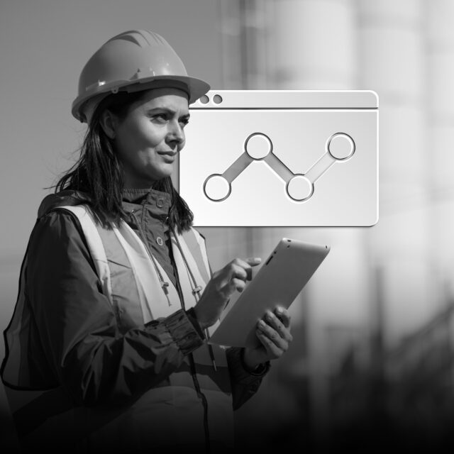 Portrait of female engineer with hardhat using digital tablet while working on her work site
